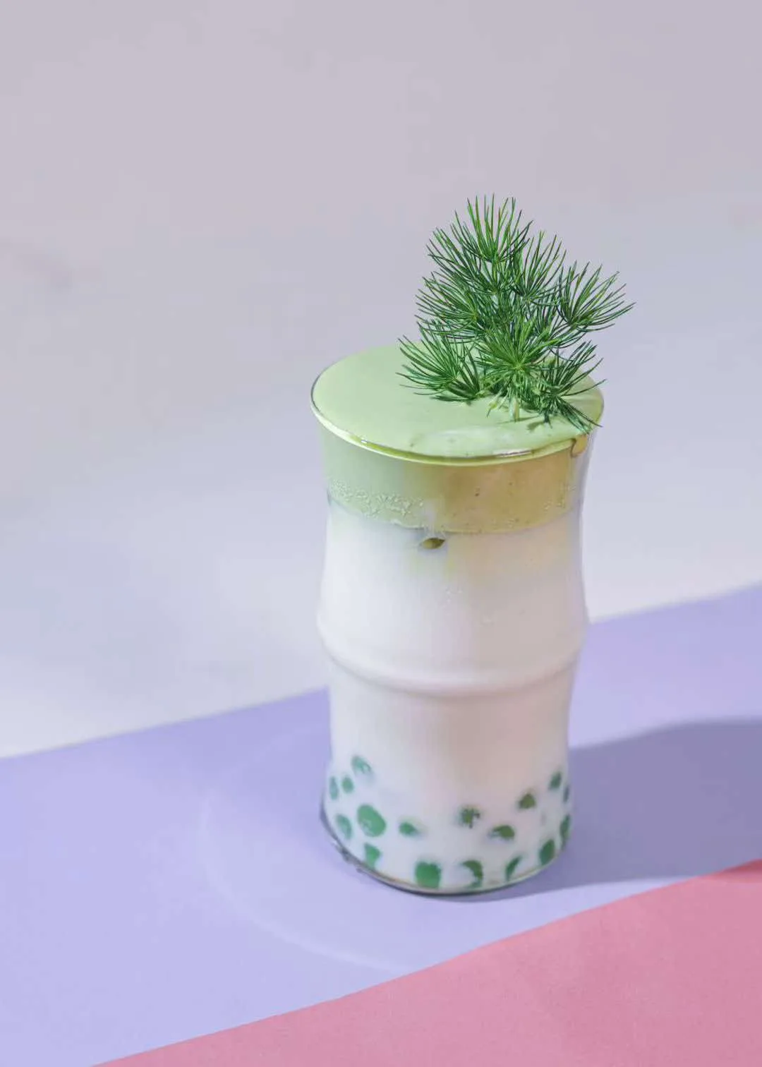 Matcha latte in a bamboo-joint cup
