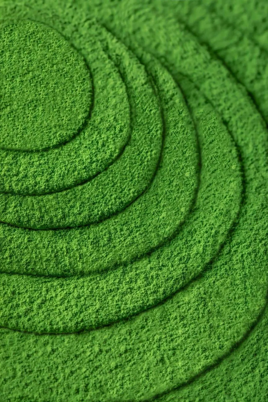 Close-up of freshly milled matcha powder swirls